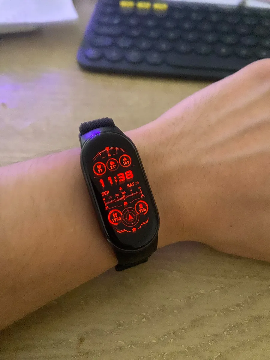 Red HUD-themed watch face with a decorative compass